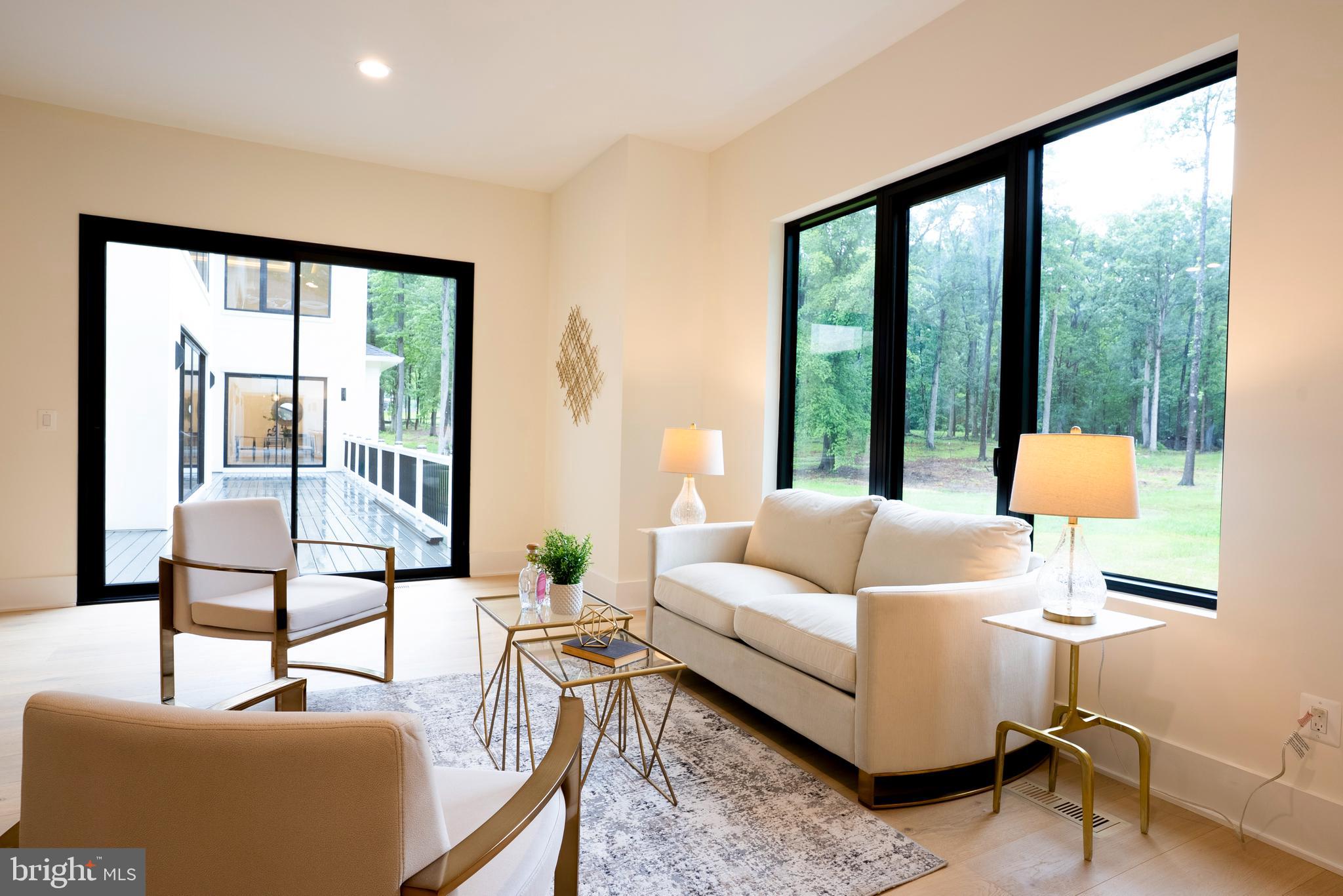 5947 Doyle Road Clifton, VA 20124 - Photo 28 of 69 a living room with furniture and a large window