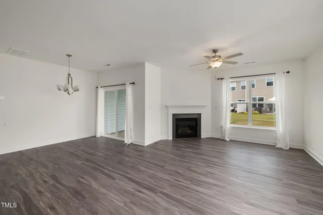 a kitchen with a sink cabinets and wooden floor