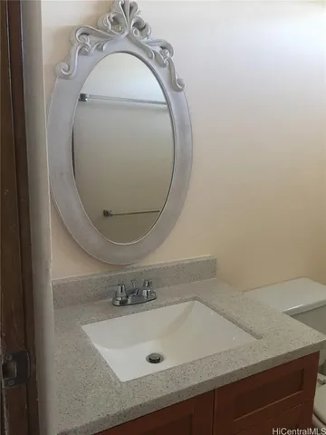 closeup of a sink with a mirror
