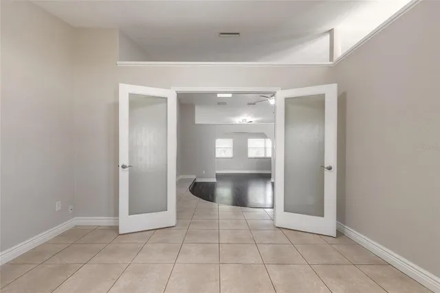 a view of an empty room and window in a house
