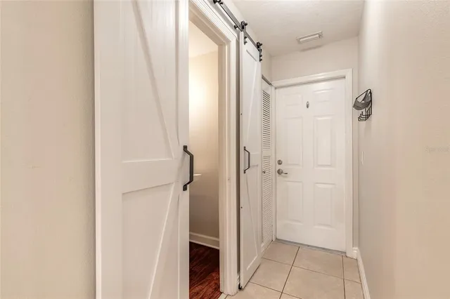 a bathroom with a shower and a glass door