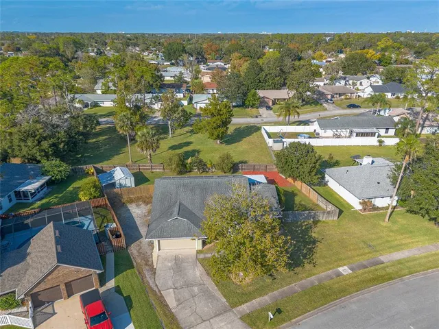 an aerial view of residential houses with outdoor space