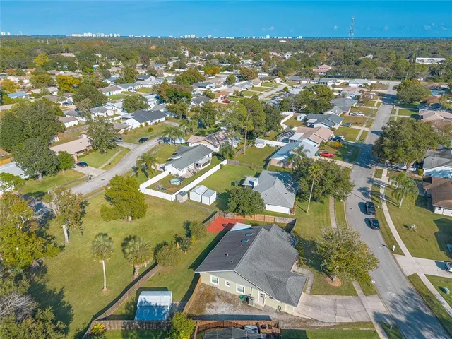 an aerial view of residential houses with outdoor space