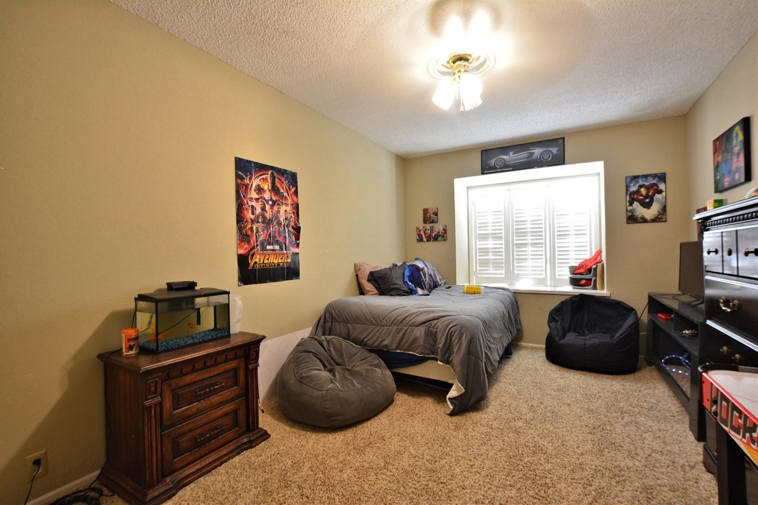3307 74th Street, Unit A Lubbock, TX 79423 - Photo 11 of 19 a bedroom with furniture and a window