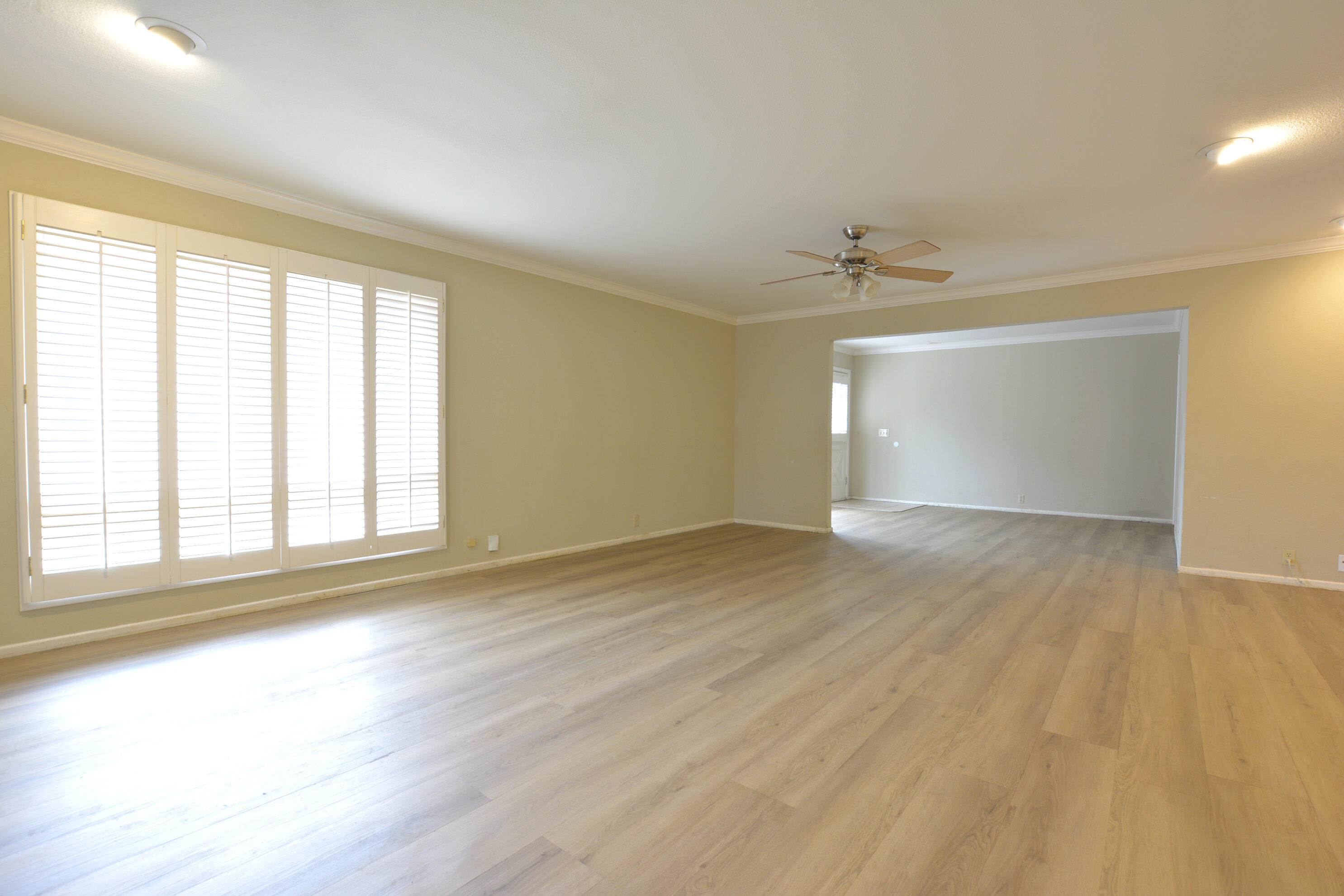 3307 74th Street, Unit A Lubbock, TX 79423 - Photo 14 of 19 an empty room with wooden floor and windows