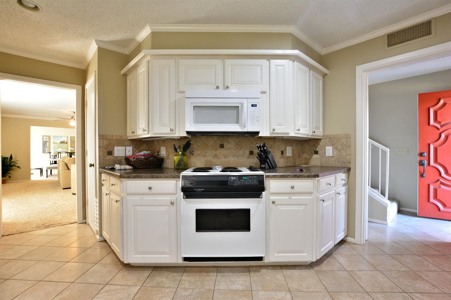 3307 74th Street, Unit A Lubbock, TX 79423 - Photo 3 of 19 a kitchen with stainless steel appliances granite countertop a stove a white and a refrigerator