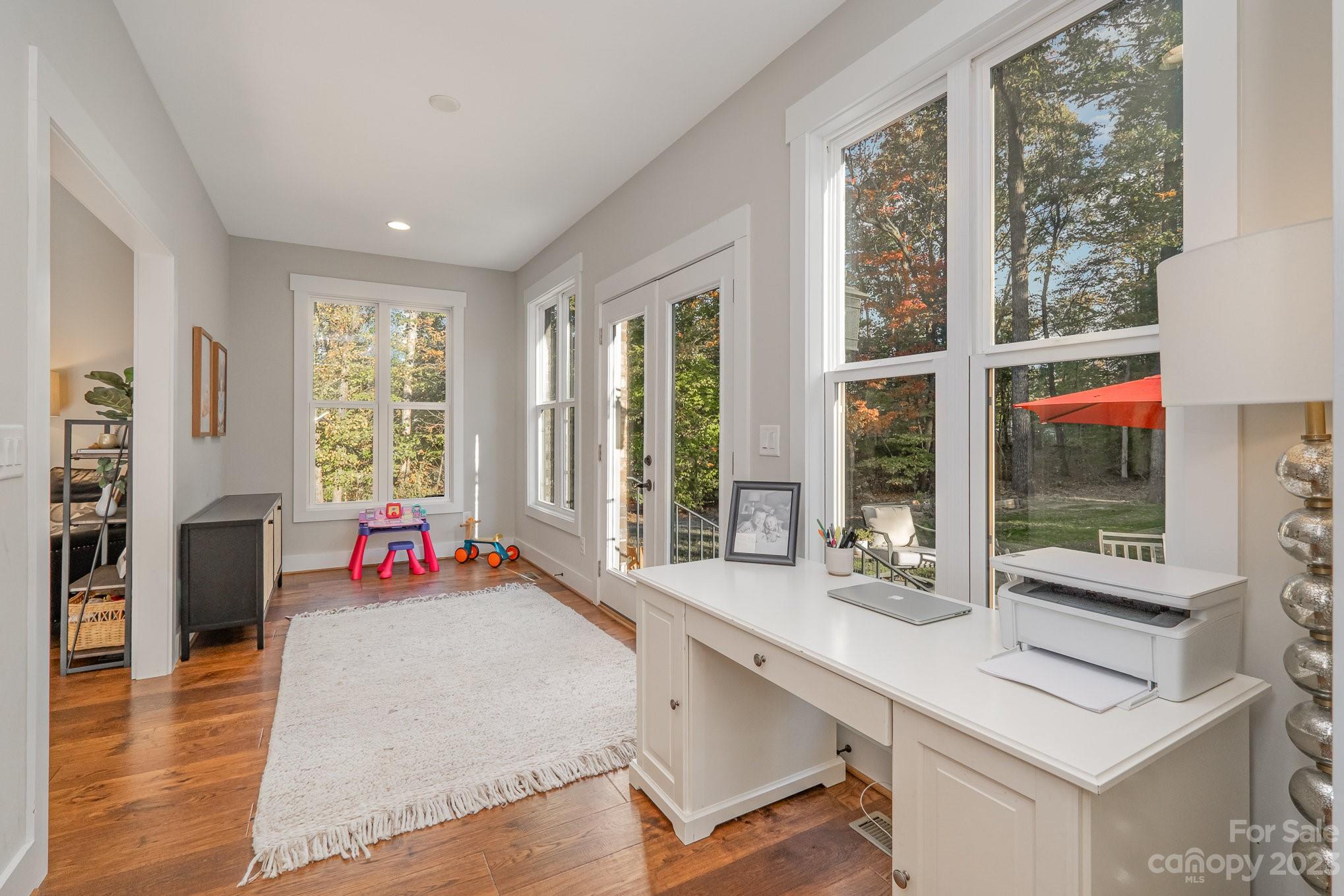 1007 Flat Rock Drive Monroe, NC 28110 - Photo 18 of 34 a living room with furniture and large windows