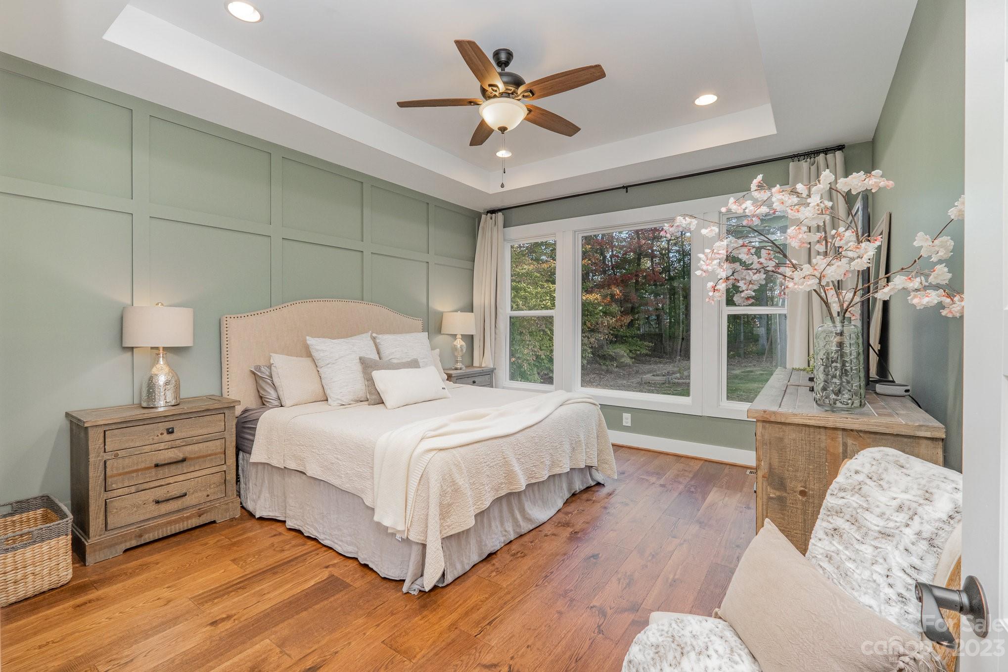 1007 Flat Rock Drive Monroe, NC 28110 - Photo 19 of 34 a bedroom with a large bed and a large window
