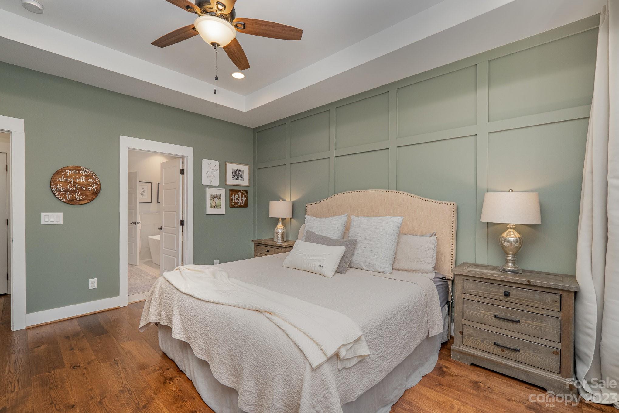 1007 Flat Rock Drive Monroe, NC 28110 - Photo 20 of 34 a bedroom with a bed and a lamp on dresser