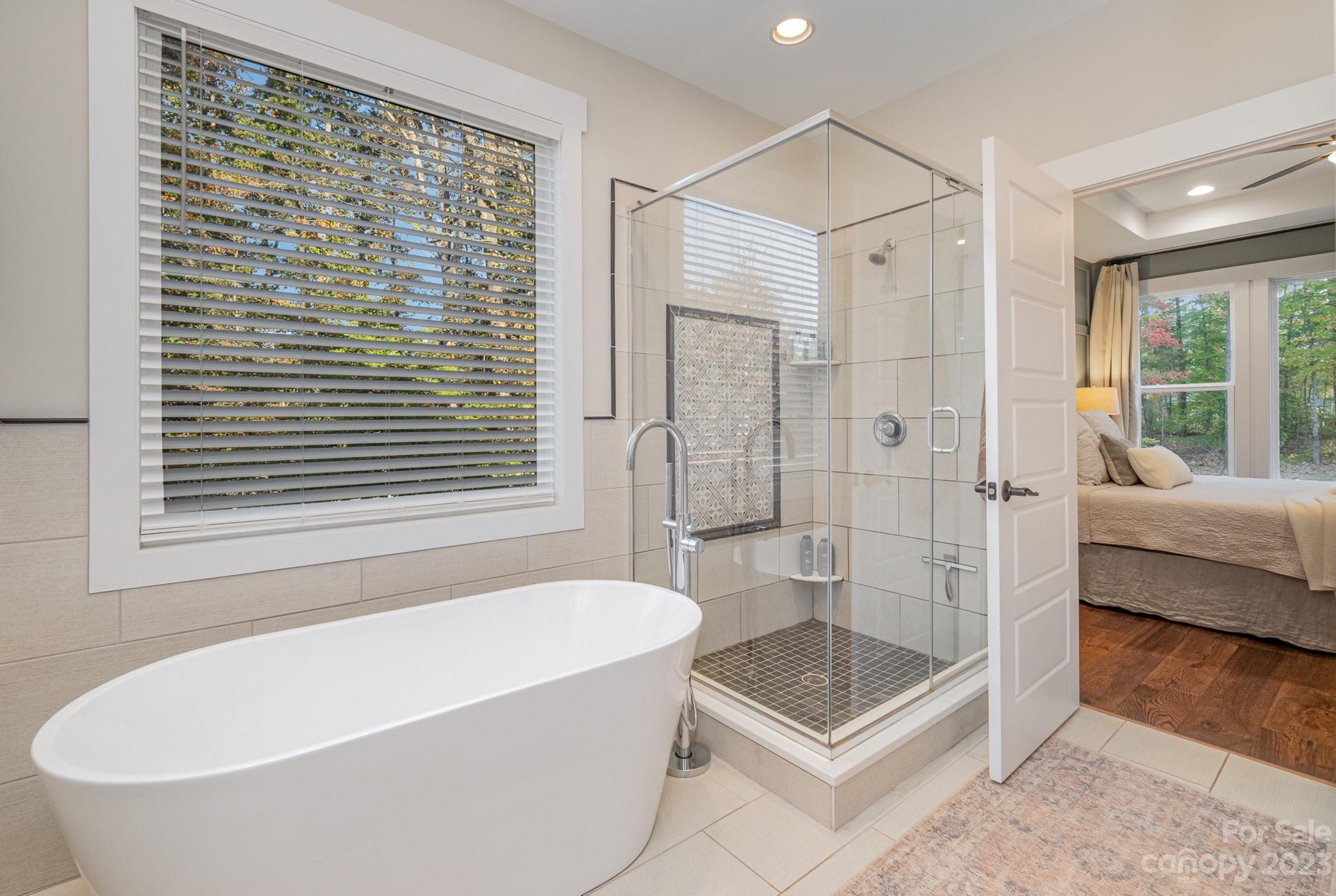1007 Flat Rock Drive Monroe, NC 28110 - Photo 22 of 34 a bathroom with a tub a toilet and a shower