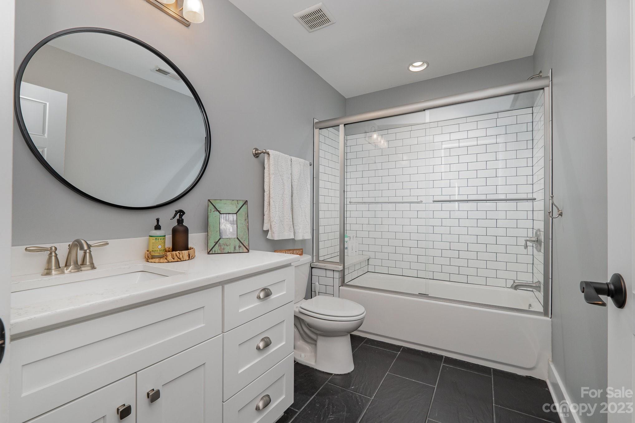 1007 Flat Rock Drive Monroe, NC 28110 - Photo 24 of 34 a bathroom with a sink a toilet and a mirror