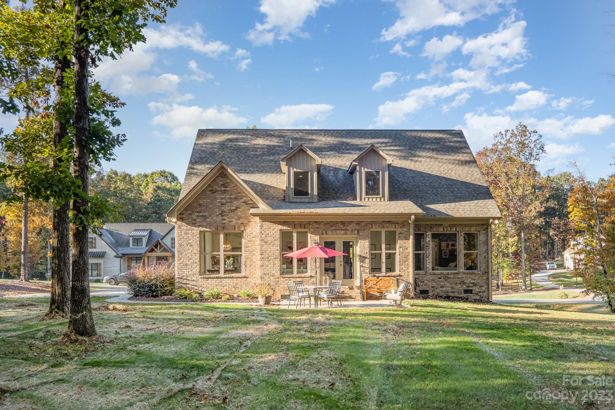 1007 Flat Rock Drive Monroe, NC 28110 - Photo 28 of 34 a front view of a house with a garden
