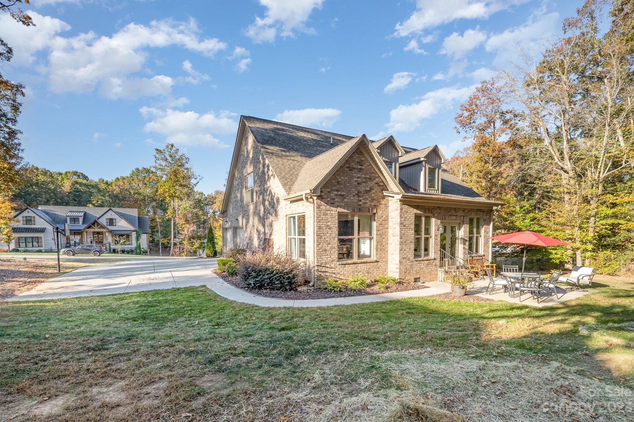 1007 Flat Rock Drive Monroe, NC 28110 - Photo 30 of 34 a front view of a house with garden