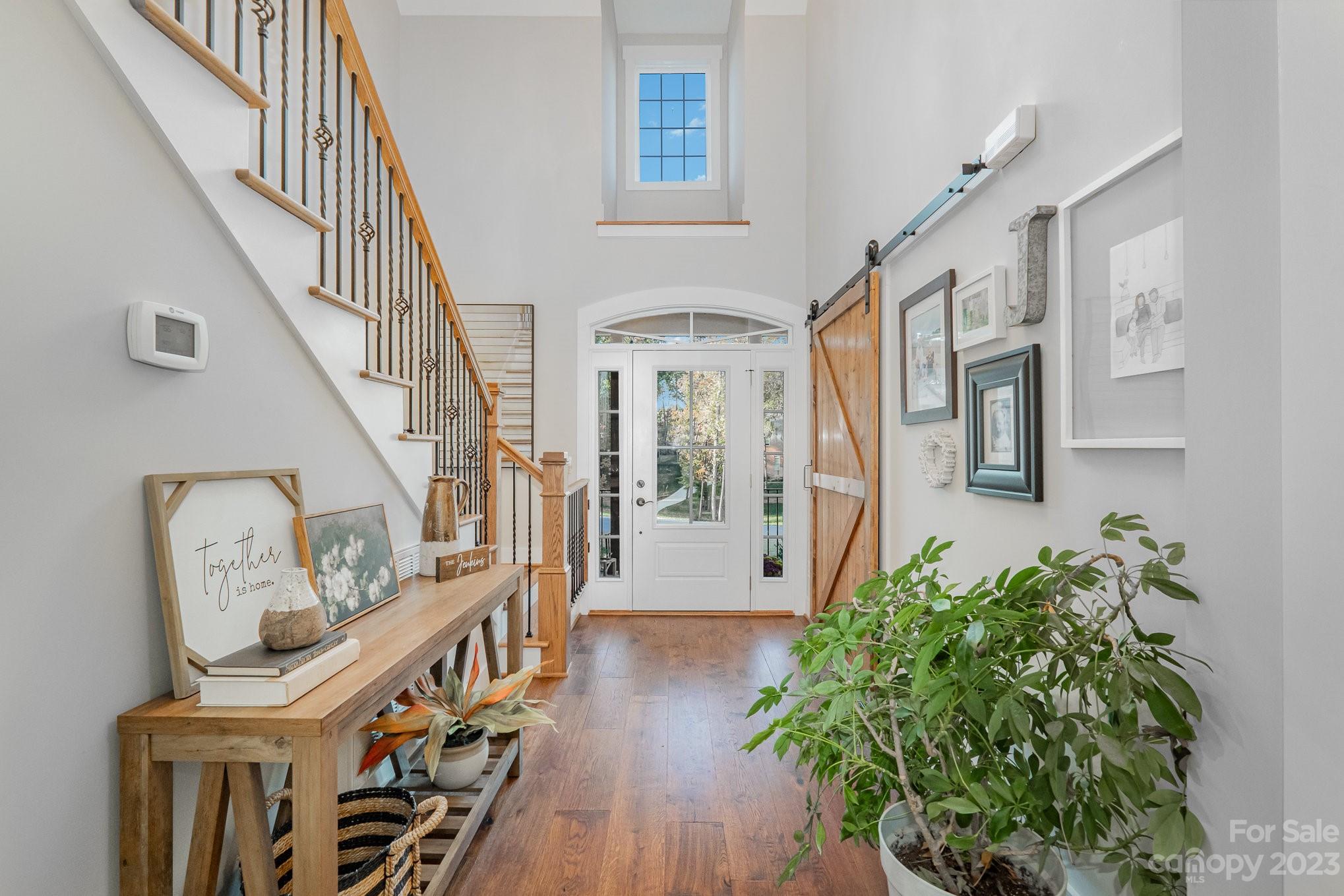 1007 Flat Rock Drive Monroe, NC 28110 - Photo 4 of 34 a view of an entryway with wooden floor and stairs