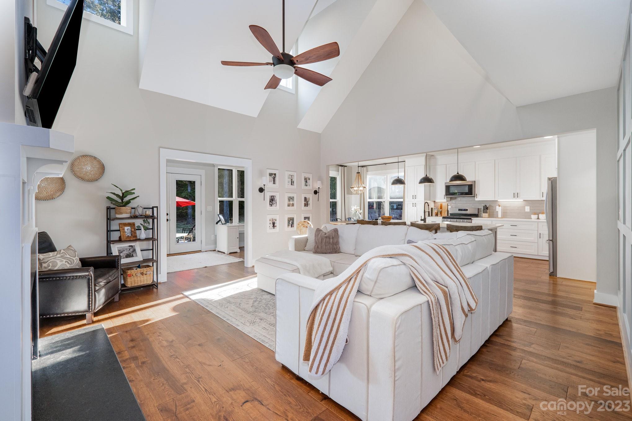 1007 Flat Rock Drive Monroe, NC 28110 - Photo 5 of 34 a living room with furniture and a flat screen tv