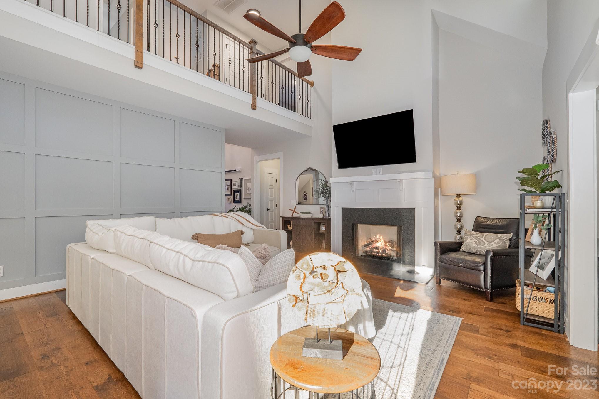 1007 Flat Rock Drive Monroe, NC 28110 - Photo 6 of 34 a living room with furniture a flat screen tv and a fireplace