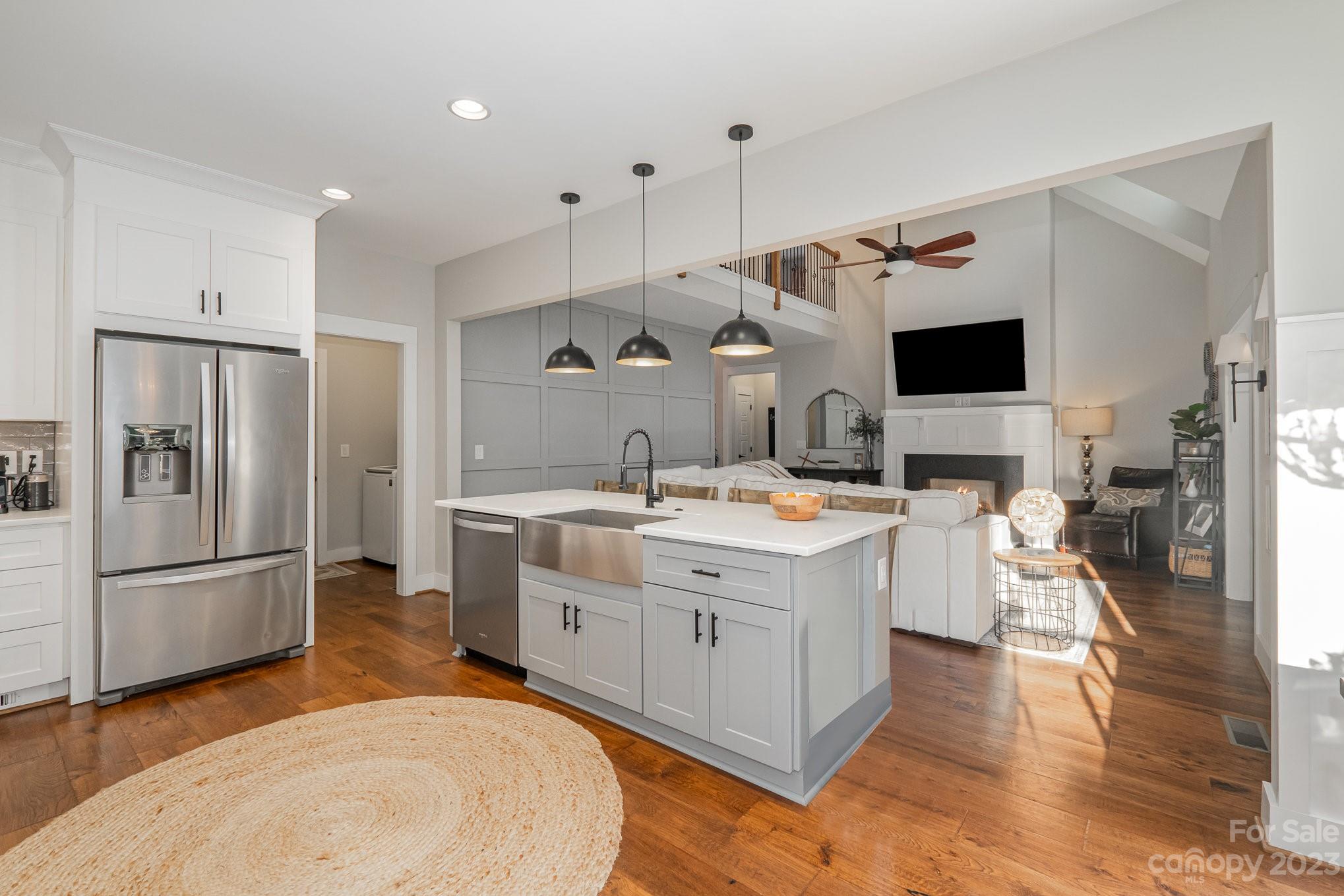 1007 Flat Rock Drive Monroe, NC 28110 - Photo 9 of 34 a large white kitchen with a large window and stainless steel appliances