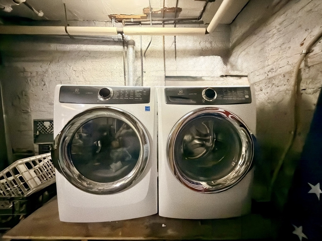 41 Pinckney Street, Unit B Boston, MA 02114 - Photo 31 of 31 a utility room with dryer and washer