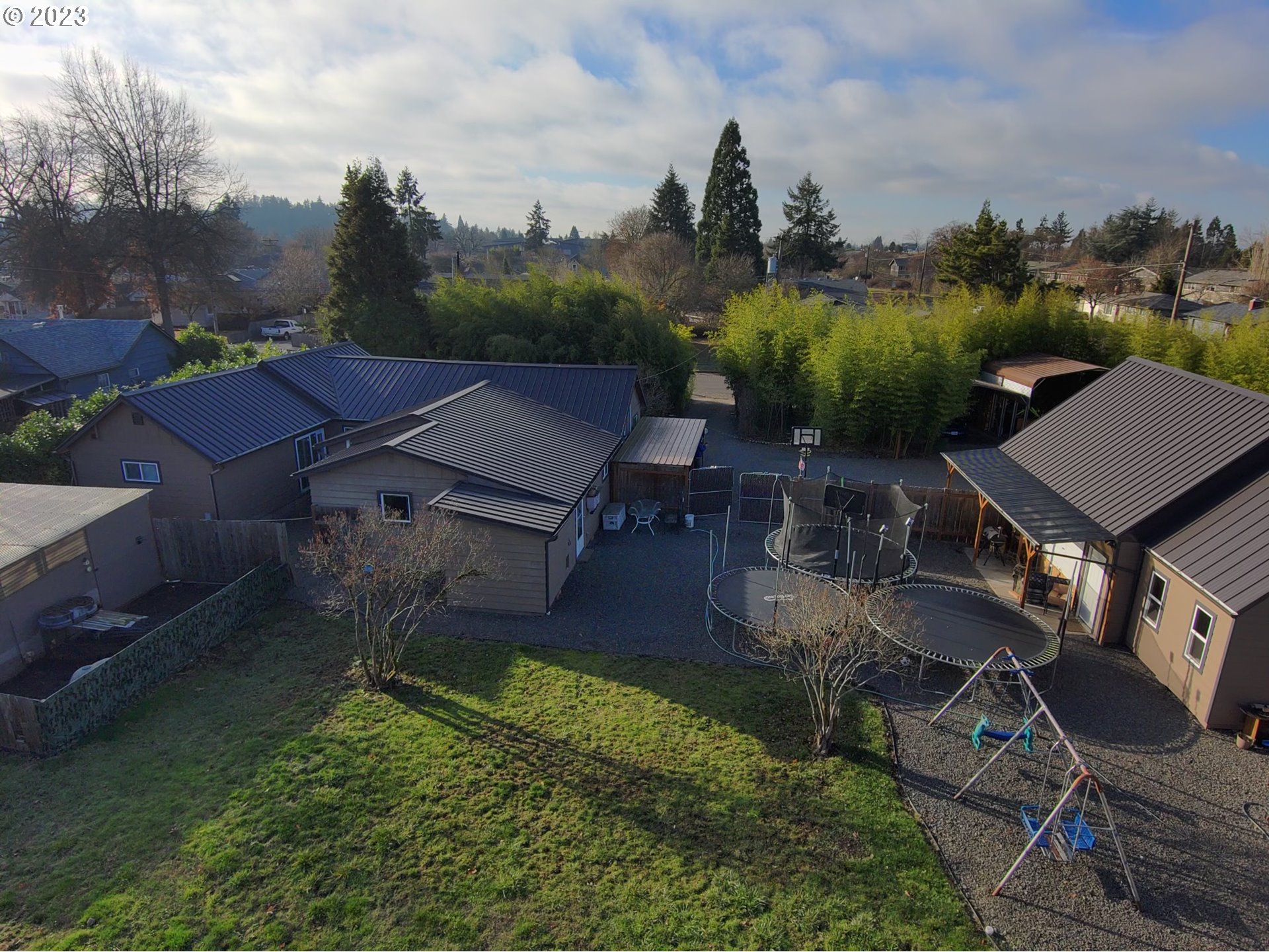 1601 7th Street Springfield, OR 97477 - Photo 2 of 16 an aerial view of a house with garden space and street view