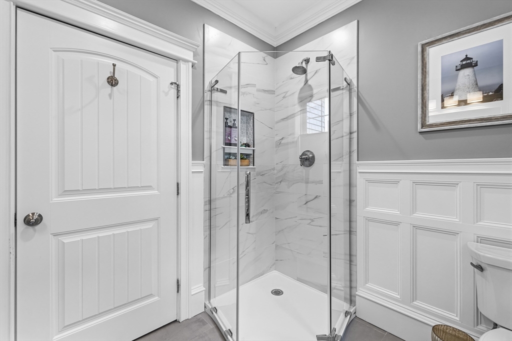 35 High Street Freetown, MA 02702 - Photo 27 of 40 a bathroom with a shower and a glass door