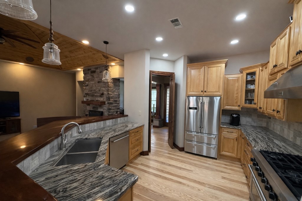 3331 Gumlog Road Young Harris, GA 30582 - Photo 15 of 39 a kitchen with stainless steel appliances granite countertop a refrigerator and a stove