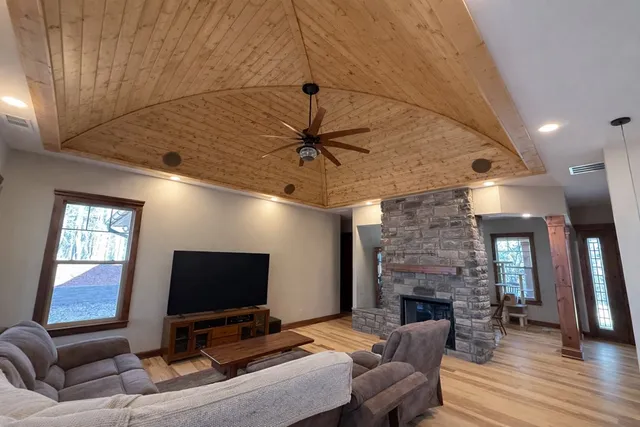 a living room with furniture and a flat screen tv