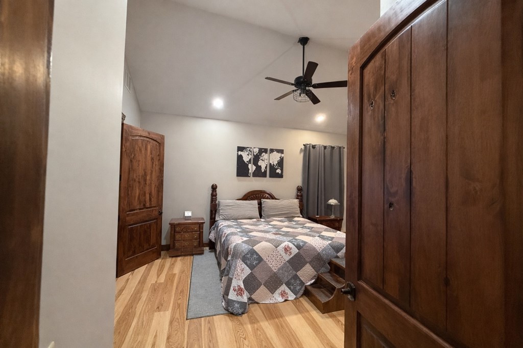 3331 Gumlog Road Young Harris, GA 30582 - Photo 20 of 39 a bed sitting in a bedroom next to a bathroom