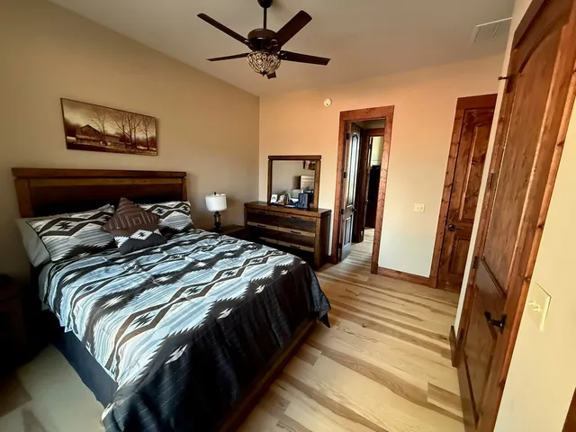 a bedroom with a bed and a mirror