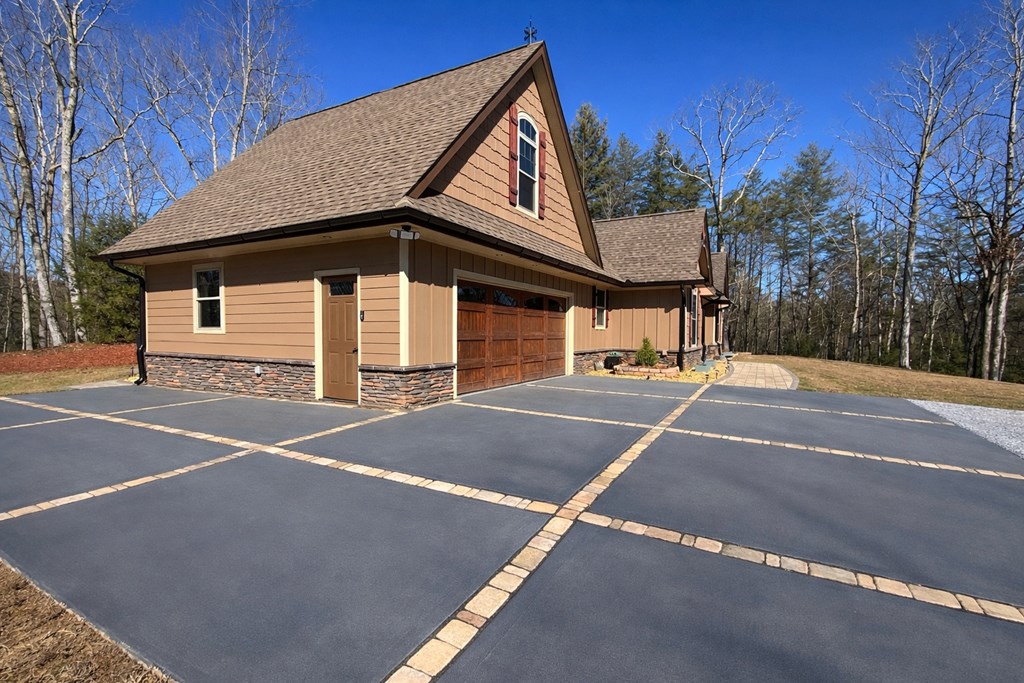 3331 Gumlog Road Young Harris, GA 30582 - Photo 3 of 39 a view of a white house with a large space and large trees
