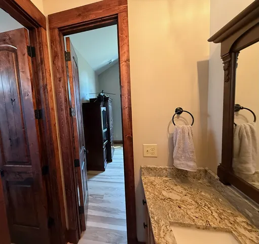 a view of a bathroom from a hallway