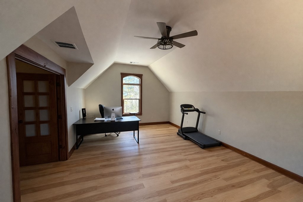 3331 Gumlog Road Young Harris, GA 30582 - Photo 38 of 39 a view of empty room with wooden floor and fan