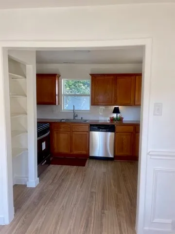 a bathroom with a sink toilet and window