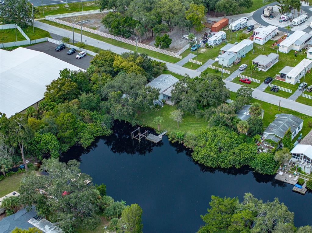 0 Flounder Drive Hudson, FL 34667 - Photo 8 of 13 an aerial view of a house with a yard and lake view
