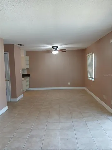 a view of an empty room with a window