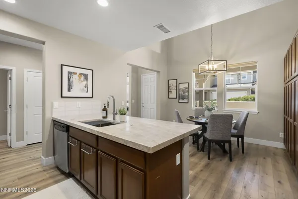 a kitchen with stainless steel appliances a sink stove and refrigerator