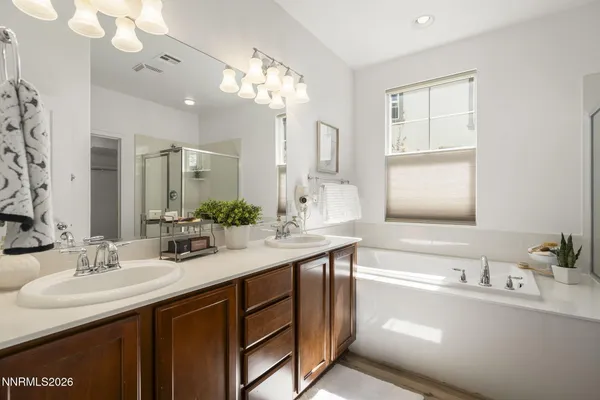 a bathroom with a bathtub and a sink