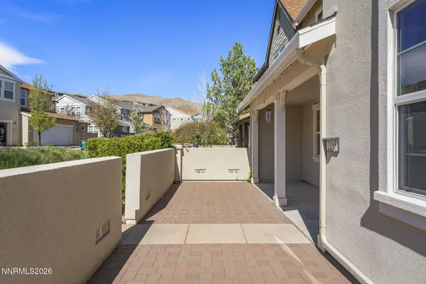 a view of a balcony with wooden fence and floor