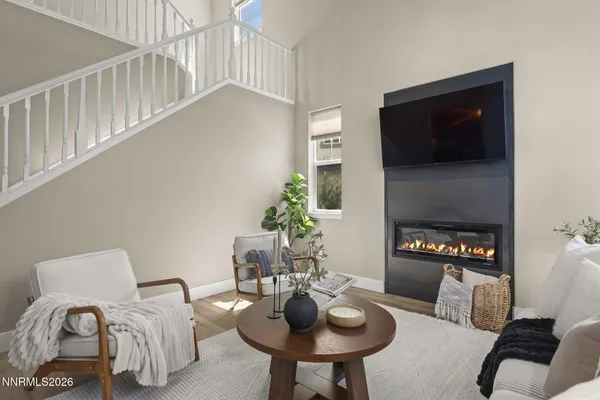a living room with furniture and white walls
