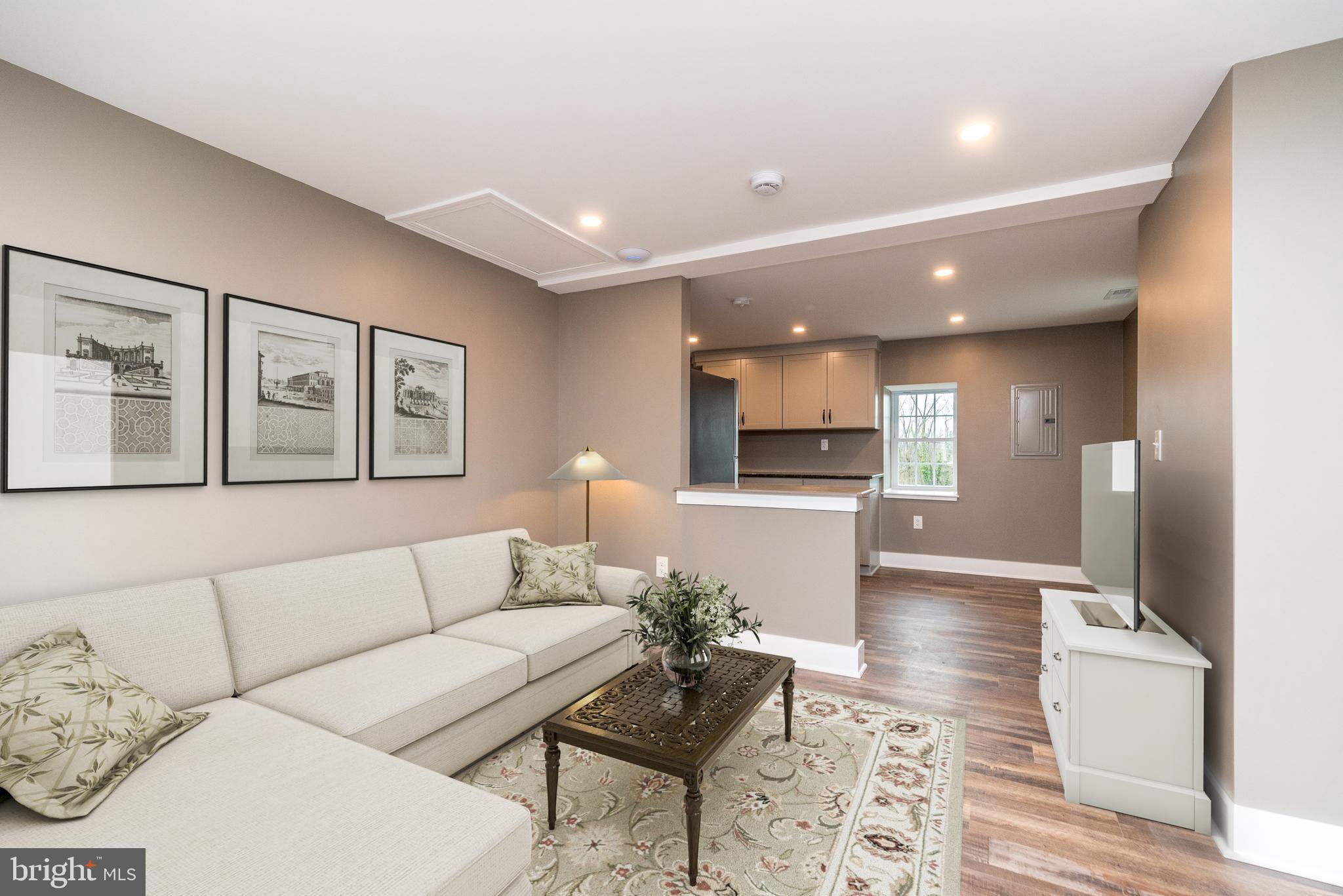 4844 Old Easton Road, Unit 2 Doylestown, PA 18902 - Photo 26 of 33 a living room with furniture and a wooden floor