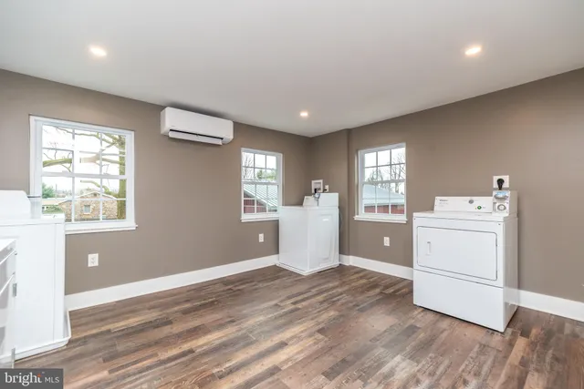 a room with a hardwood kitchen view and a window