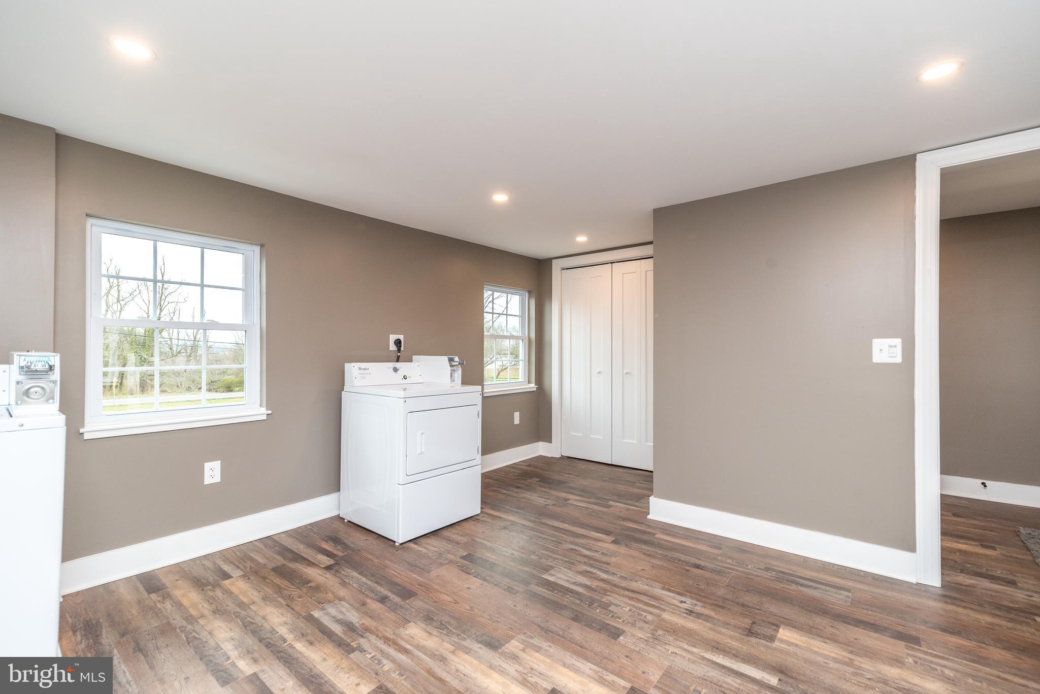 4844 Old Easton Road, Unit 2 Doylestown, PA 18902 - Photo 32 of 33 a view of a kitchen with wooden floor and white walls