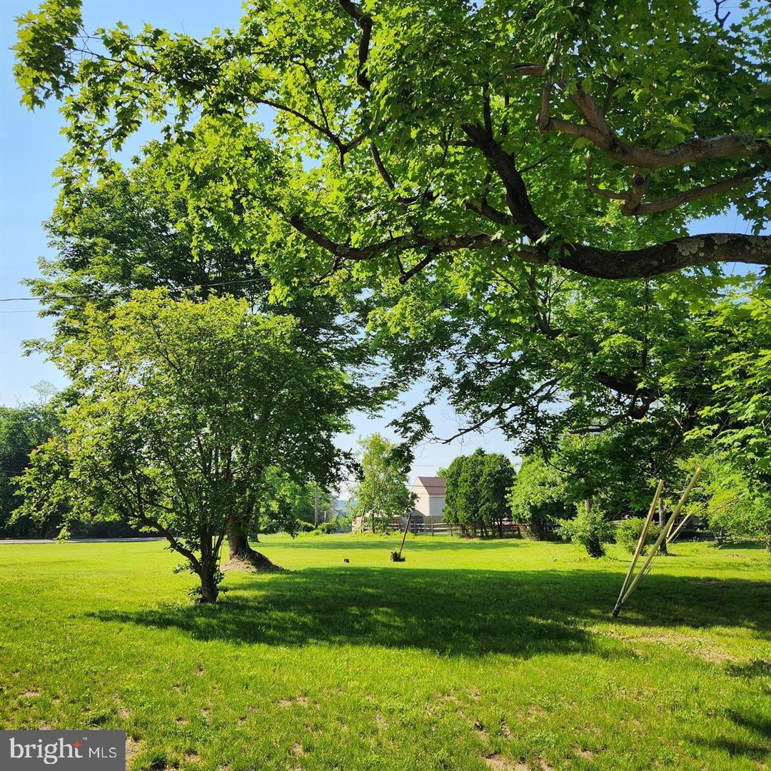 4844 Old Easton Road, Unit 2 Doylestown, PA 18902 - Photo 33 of 33 a view of grassy field with benches