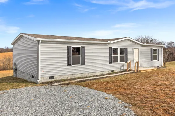 a front view of a house with a garage