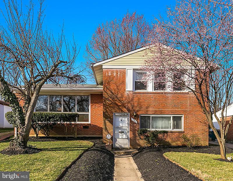 12912 Holdridge Road Silver Spring, MD 20906 - Photo 1 of 25 a front view of a house with a yard