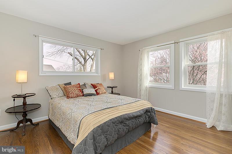 12912 Holdridge Road Silver Spring, MD 20906 - Photo 12 of 25 a bedroom with a bed and a window