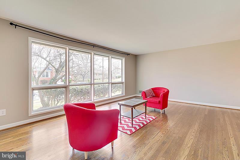 12912 Holdridge Road Silver Spring, MD 20906 - Photo 14 of 25 a living room with furniture and a large window