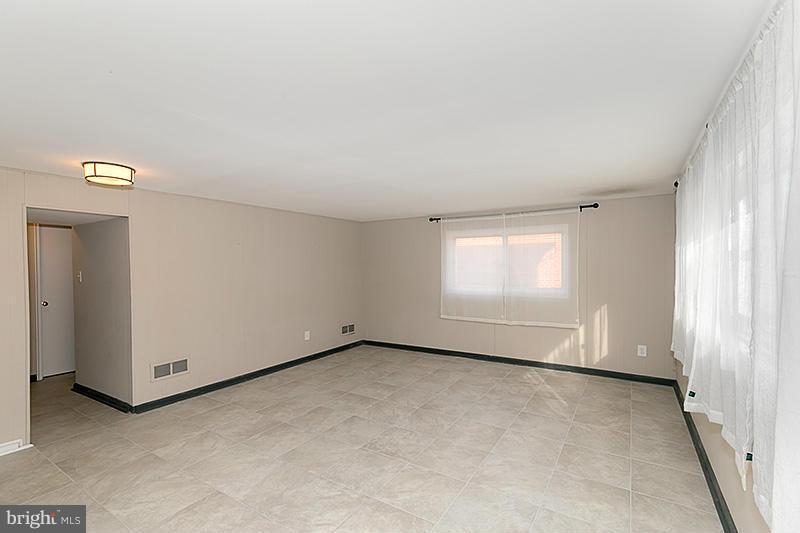 12912 Holdridge Road Silver Spring, MD 20906 - Photo 18 of 25 an empty room with windows