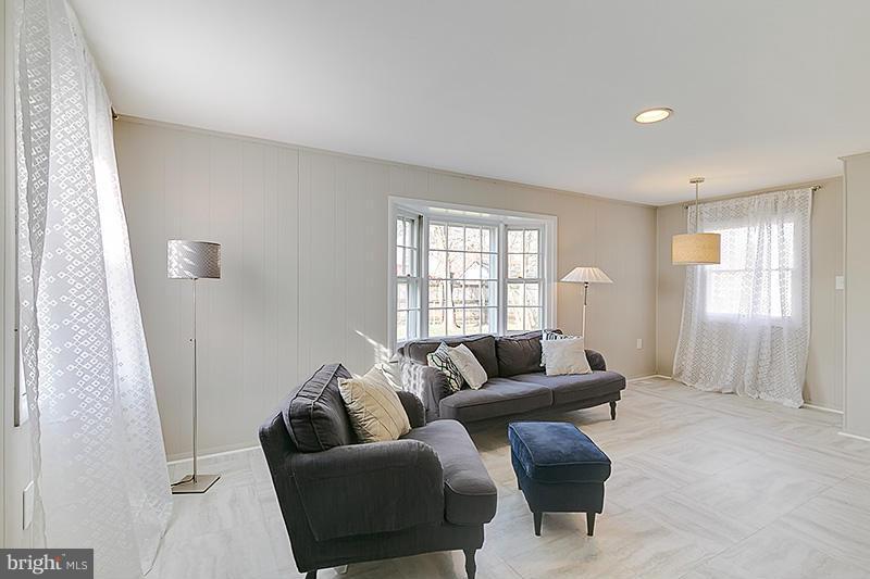 12912 Holdridge Road Silver Spring, MD 20906 - Photo 3 of 25 a living room with furniture and a window