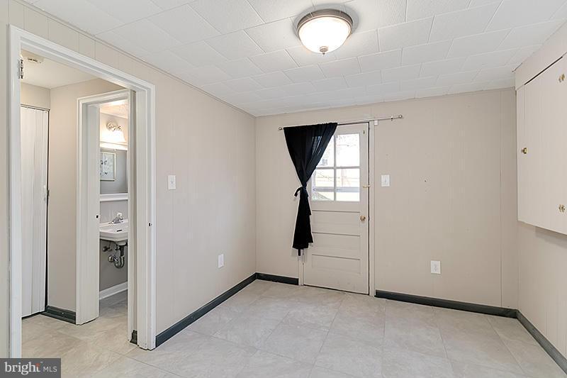 12912 Holdridge Road Silver Spring, MD 20906 - Photo 22 of 25 an empty room with windows