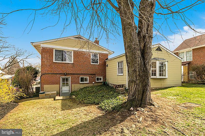12912 Holdridge Road Silver Spring, MD 20906 - Photo 23 of 25 a front view of a house with a yard